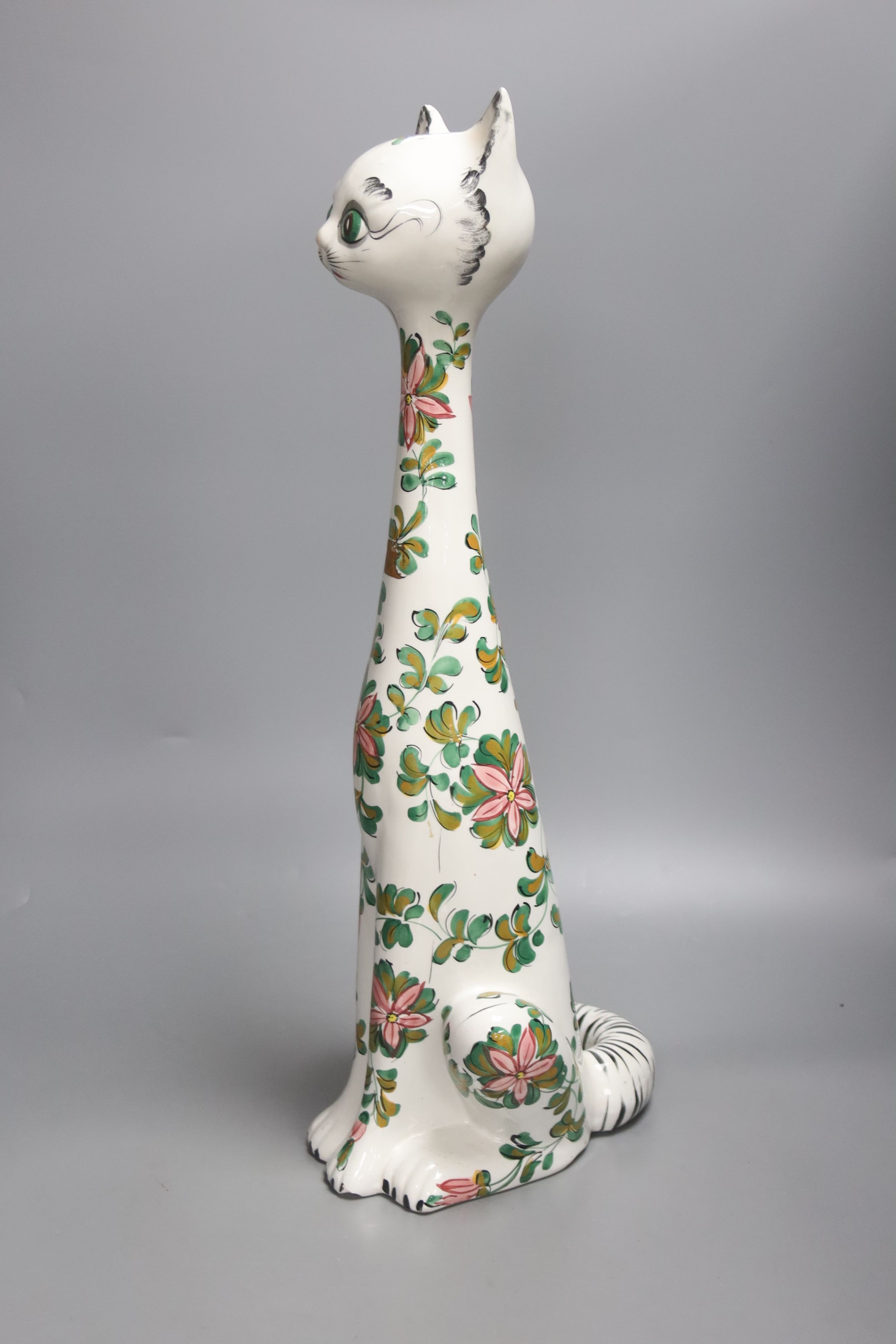 A tall Italian ceramic floral decorated cat, 57cm high